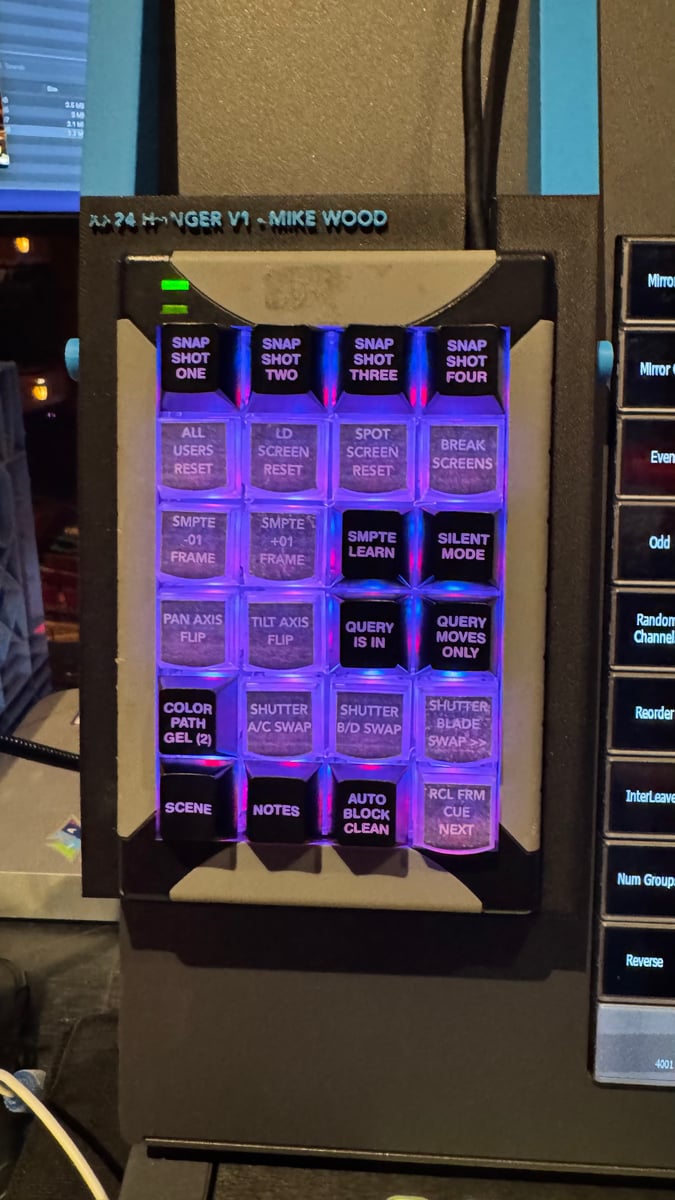 Custom XKeys macro panel labeled 'XR-24 Hanger V1, Mike Wood' with backlit buttons for Snap Shots, SMPTE, Color Path Gel, Scene, Notes, and other programmer macros