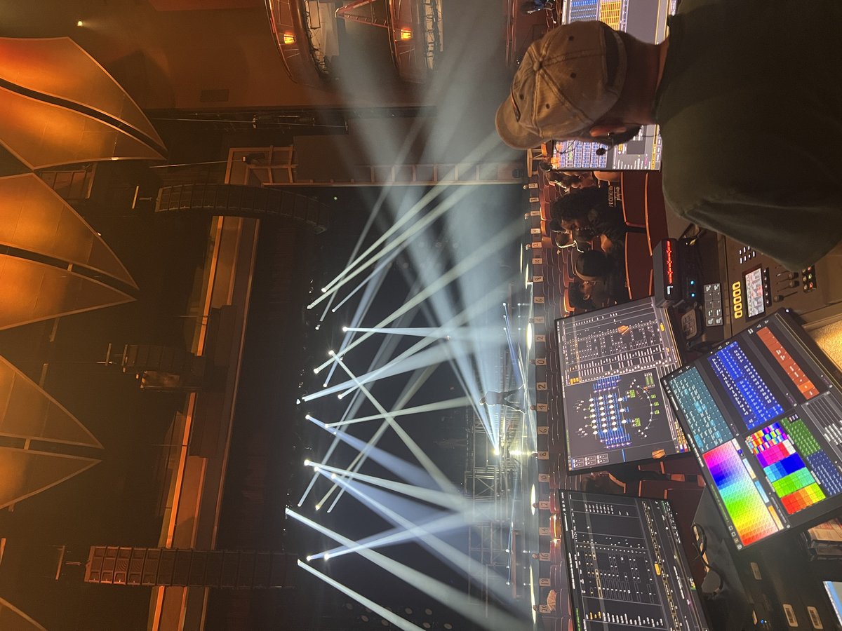 Beams through haze over the tech table backstage.
