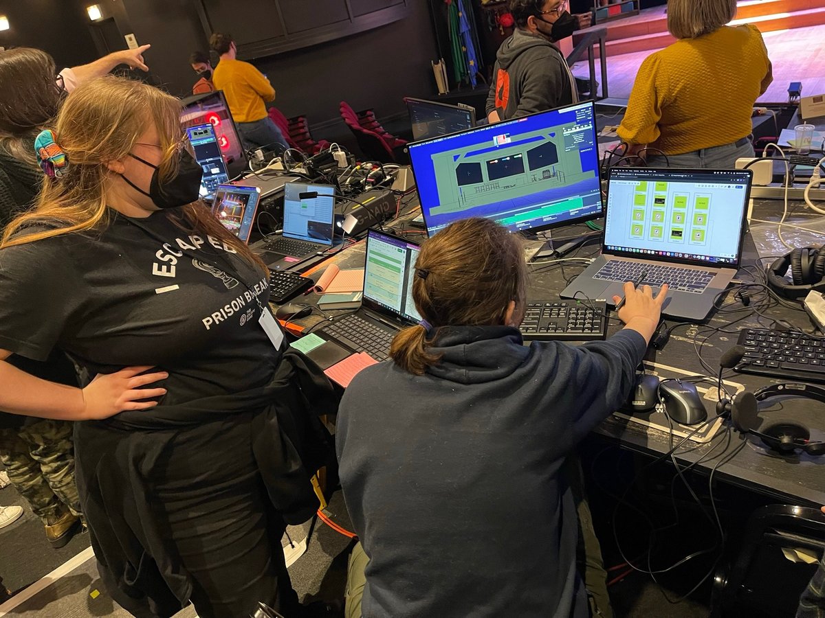 The lighting team programming at the tech table during tech.