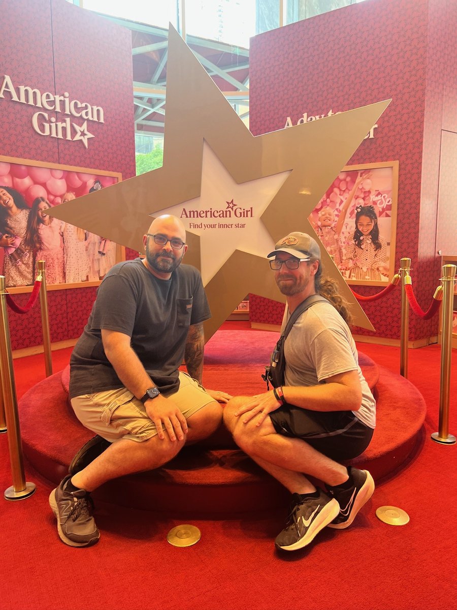 Team members at the venue's photo backdrop.