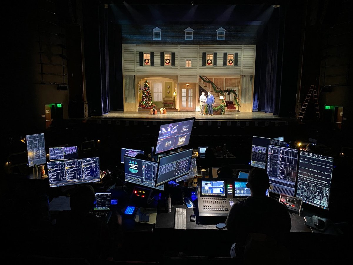 The fully lit White Christmas set seen from the tech tables at the back of the house.