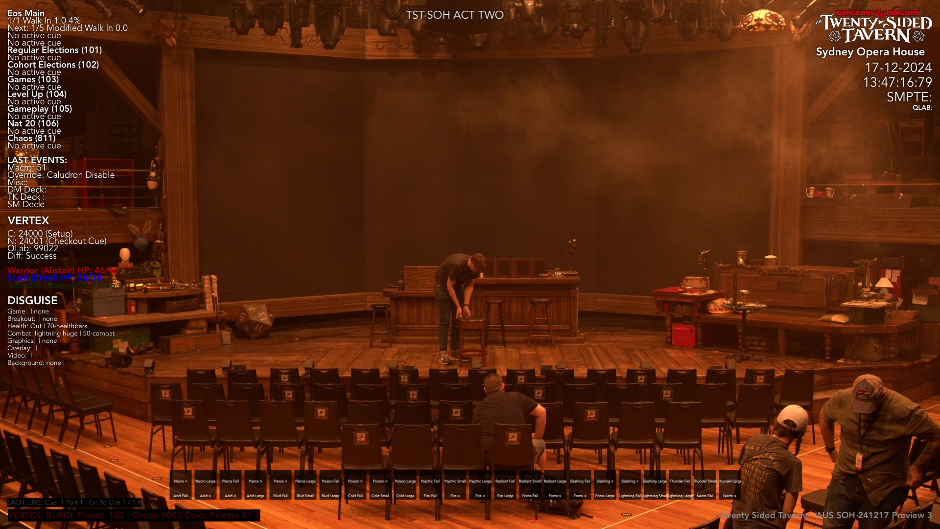 The tavern build at the Sydney Opera House mid-reset: haze, open white light, crew straightening chairs