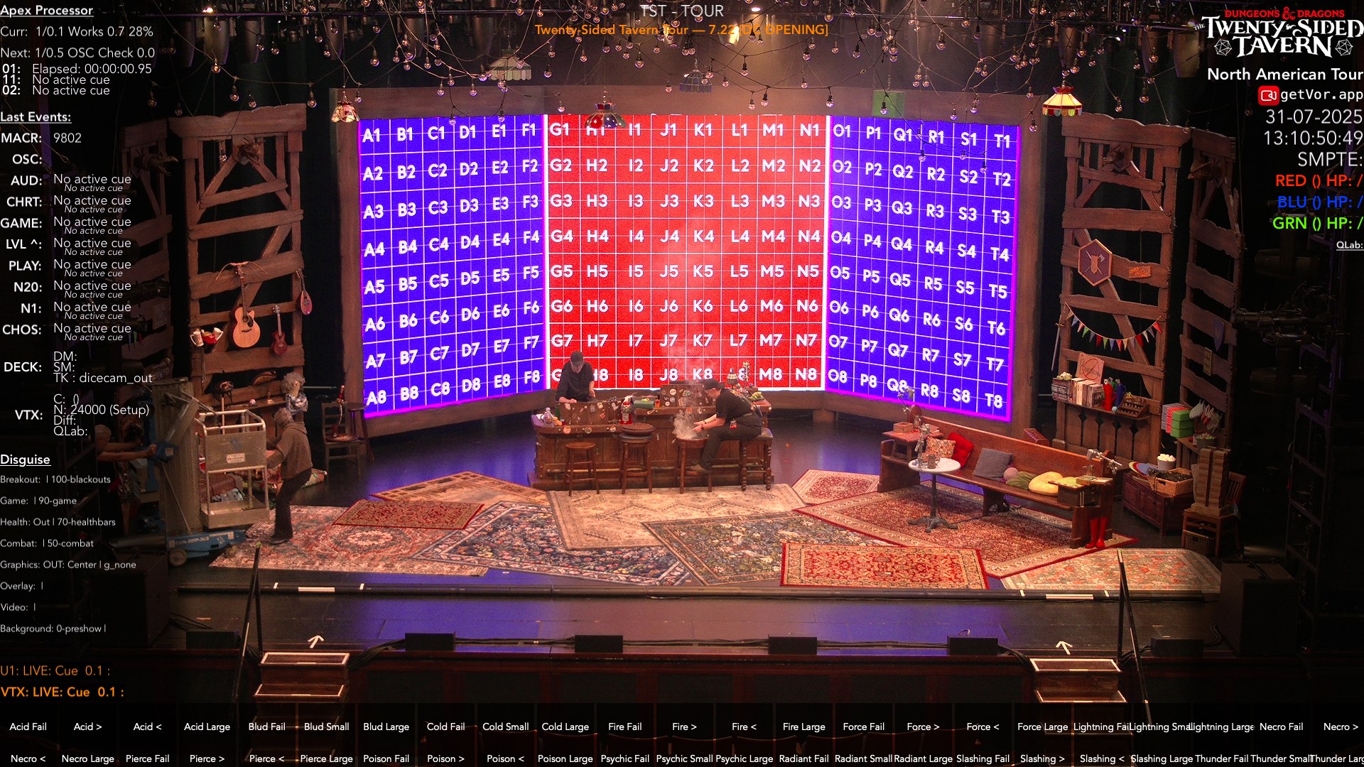 The touring tavern in its works cue: the LED wall running a seat-map test grid, crew at the tavern tables