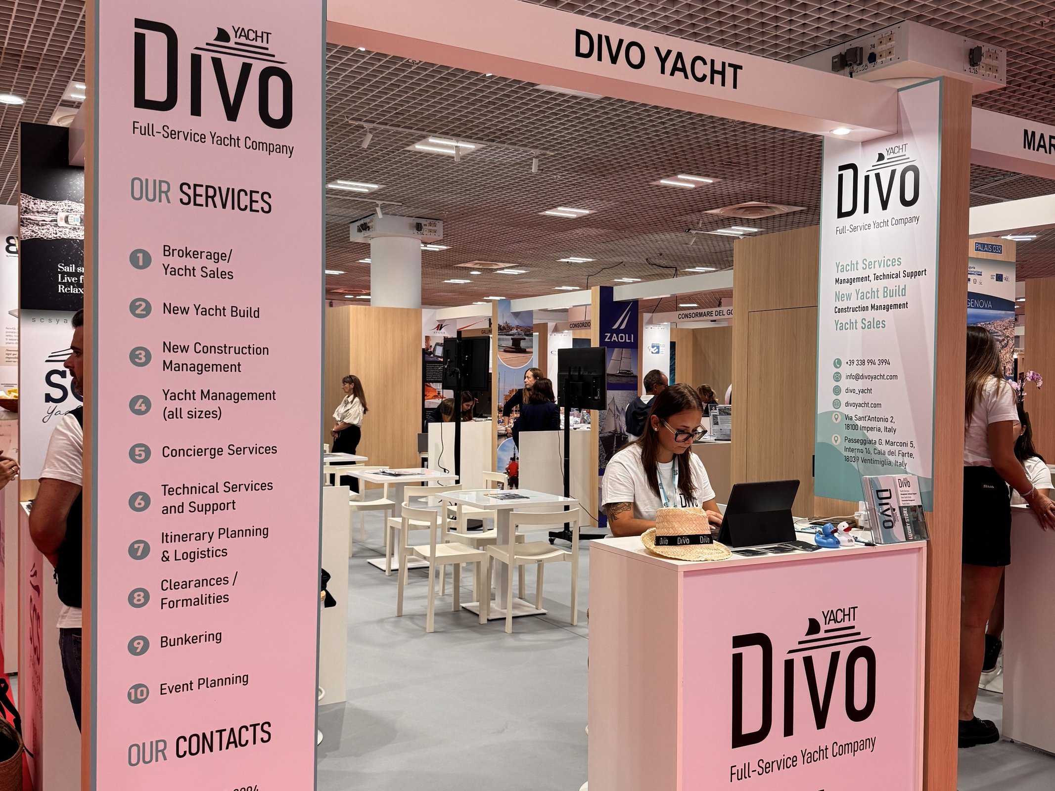 The Divo Yacht stand at the Cannes Yachting Festival, with the full-service yacht company services and contacts displayed