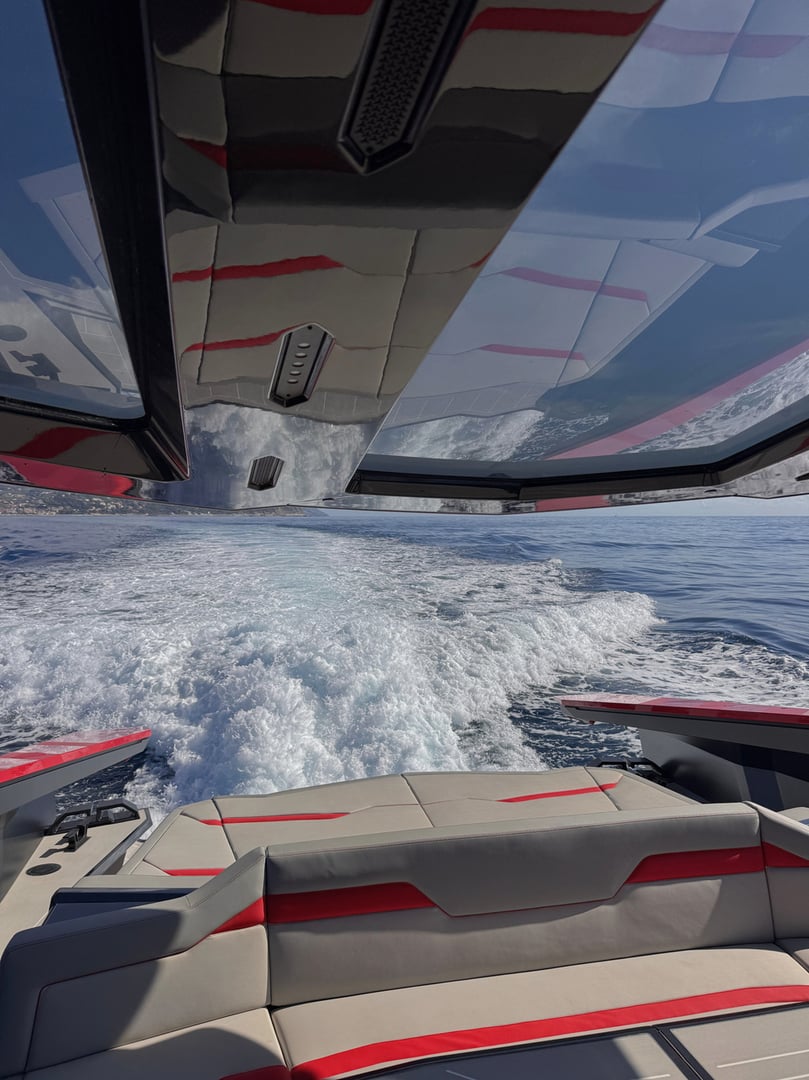 Tecnomar for Lamborghini 63 VALKYRIE running at speed, red carbon-fibre hull profile