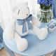 Urso Branco com Laço Azul Bebê 25cm - imagem 2