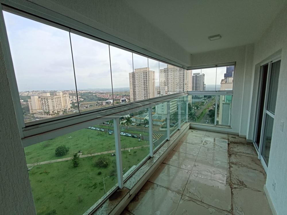 Vista urbana de São Carlos SP, com áreas verdes e prédios residenciais ao fundo