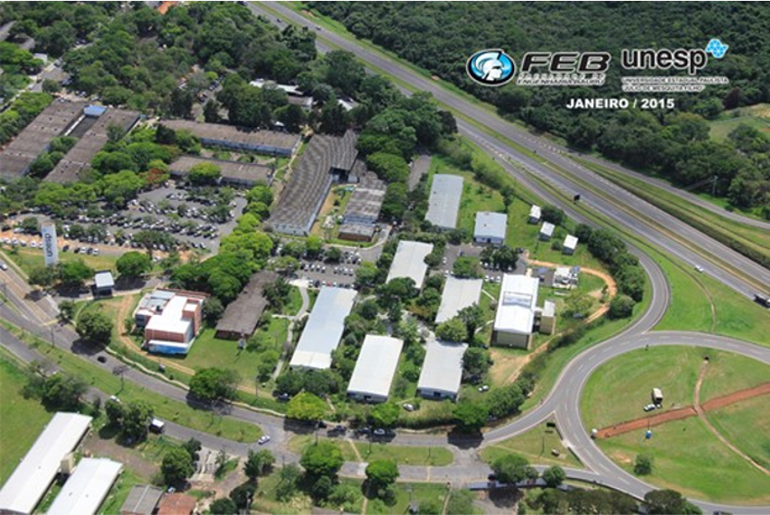 Vista aérea do campus da Unesp em Bauru, com prédios acadêmicos e áreas verdes