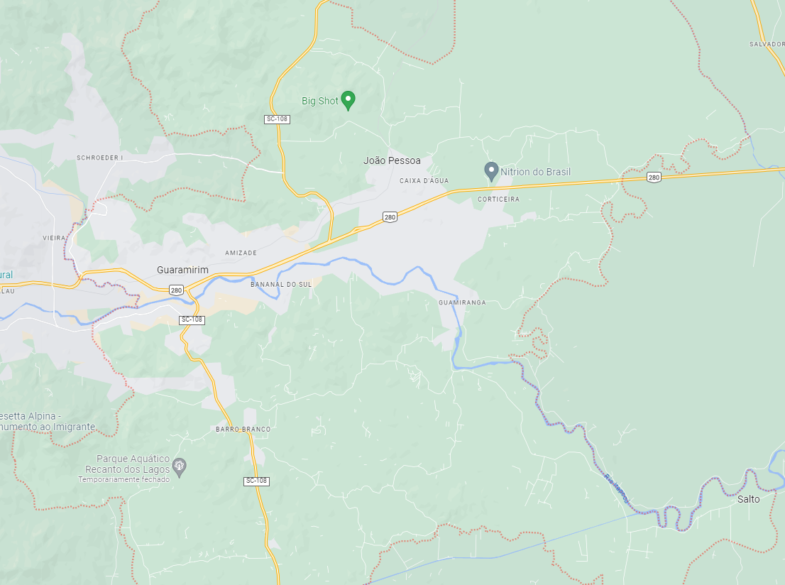 Vista aérea de Guaramirim SC em dia claro, com área urbana e vias principais