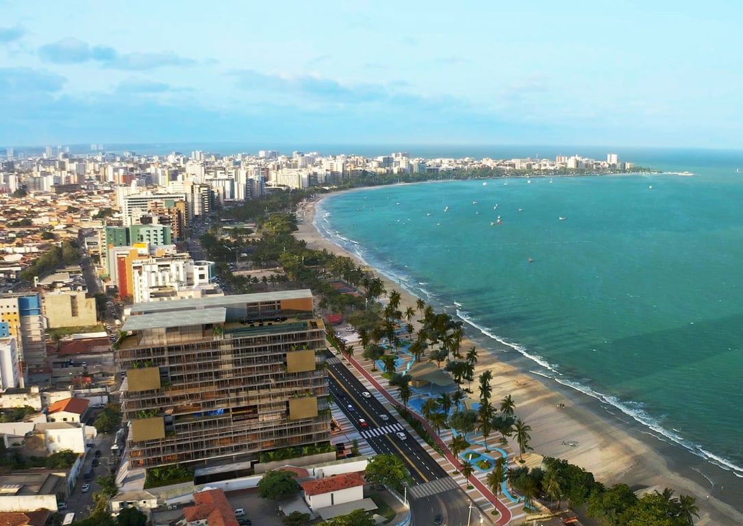 Orla de Maceió AL, vista aérea com mar azul e prédios ao fundo