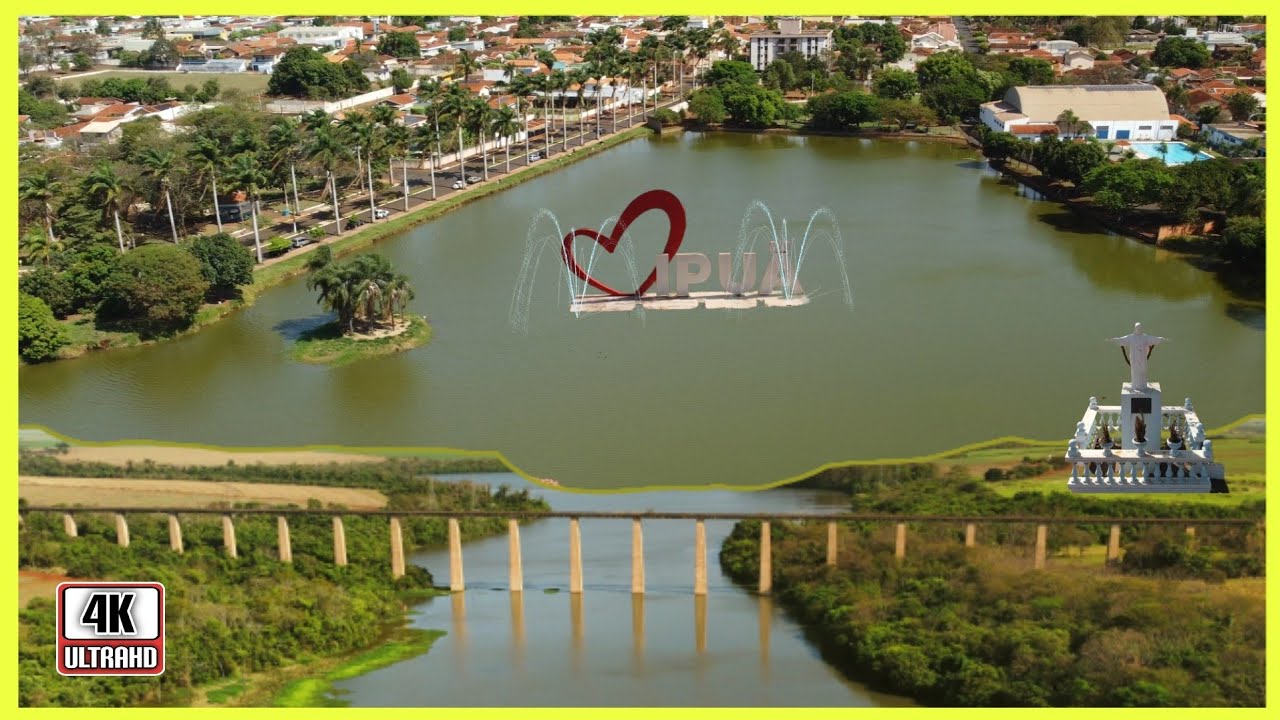 Vista urbana de Ipuã SP ao entardecer, com área central e campos ao fundo
