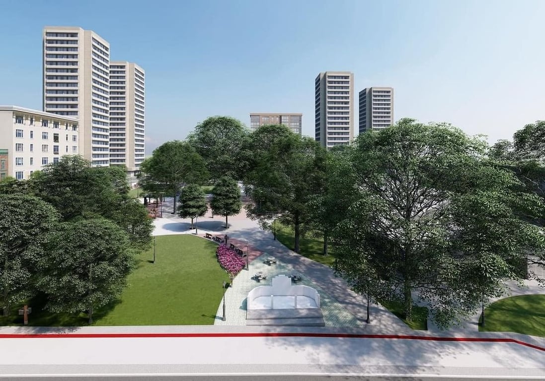 Centro de Ibirubá (RS) em dia ensolarado, com área verde e prédios ao fundo