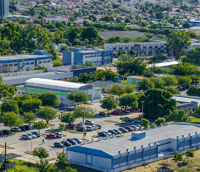 Vista aérea do campus central da UFRN, em Natal RN, com prédios acadêmicos e áreas verdes