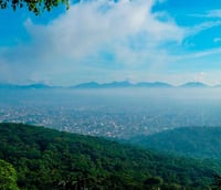 Foto panorâmica de Joinville SC com áreas verdes e montanhas ao fundo