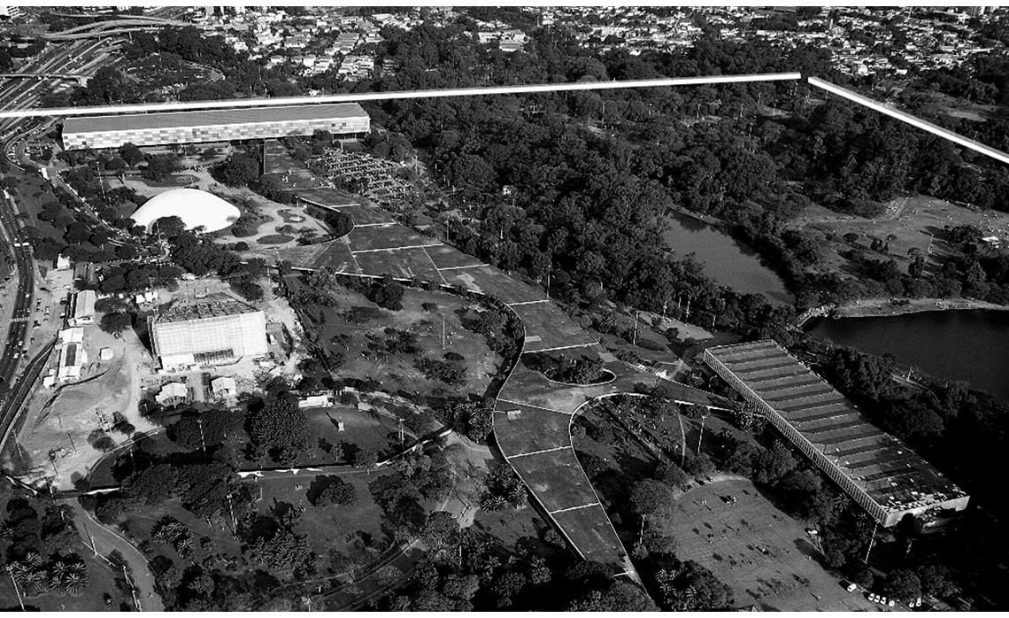 Vista aérea do campus da USP, com áreas verdes e edifícios acadêmicos ao fundo
