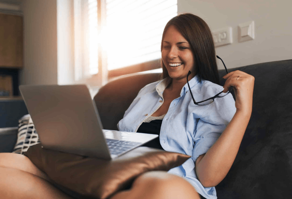remote worker doing her tasks in her laptop