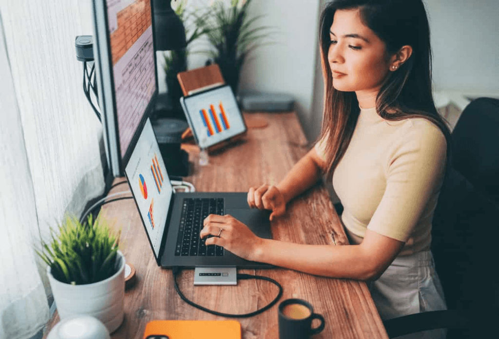 employer looking at the insights and analytics of her virtual assistant's performance