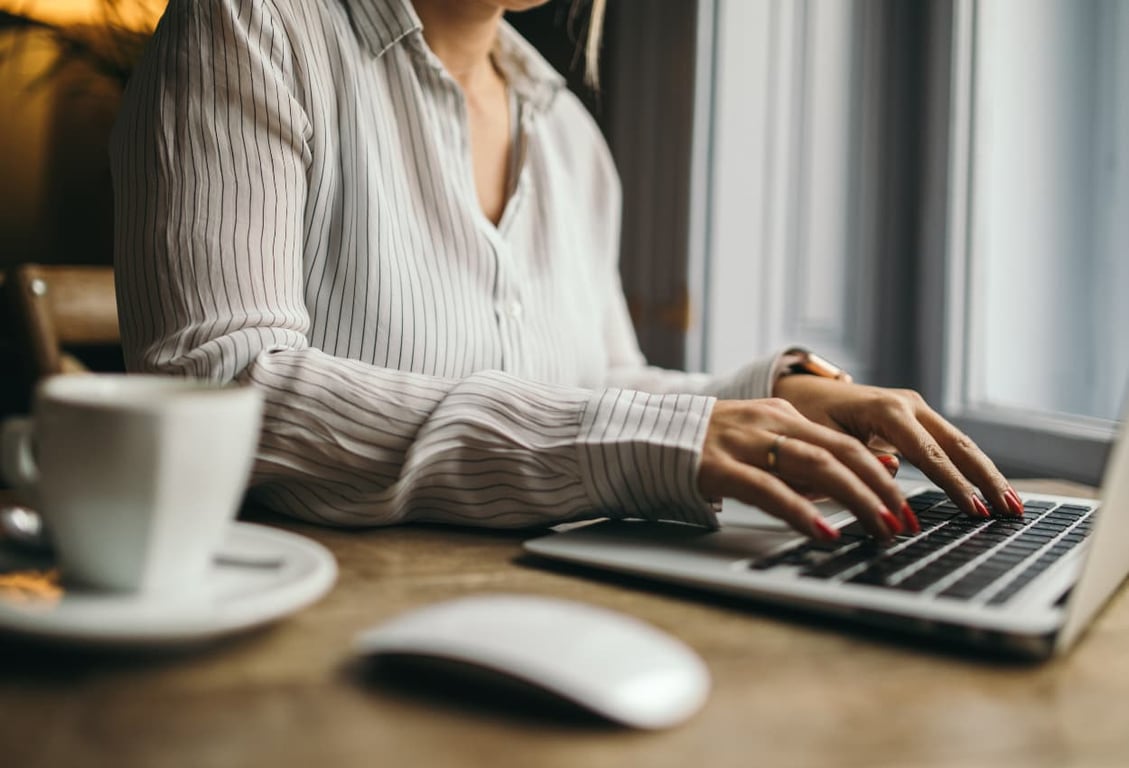 remote administrative assistant working in her laptop