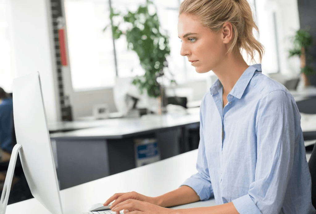 VA doing data entry task on her desktop