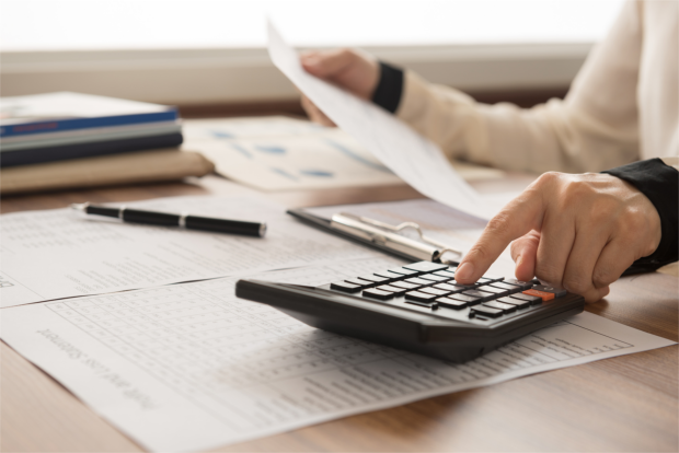Financial Accountant calculating expenses