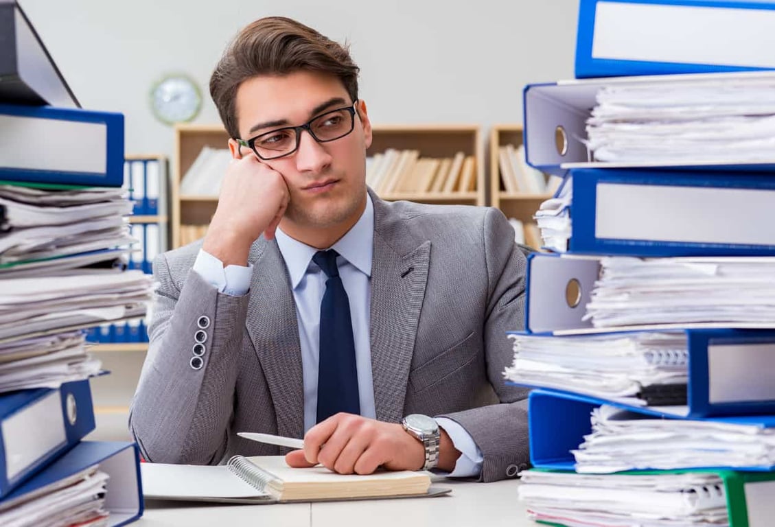 a stressed businessman with too much workload
