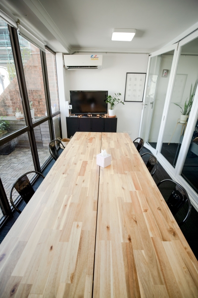 A dedicated desk in a creative video agency office photo 5
