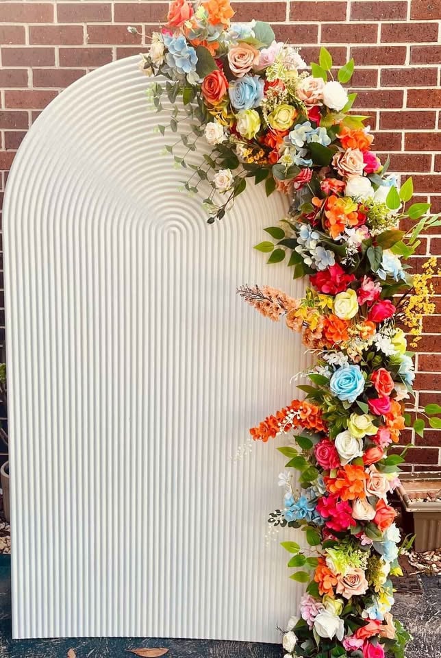 Hire - ripple arch with 2M flowers panel $125 Ripple plinth $25 photo 4