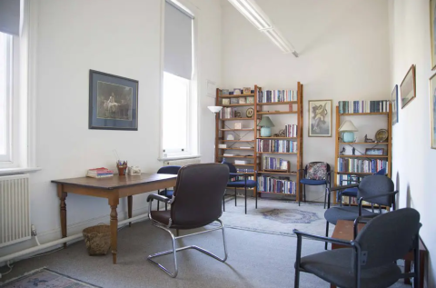 Office-share in plant-filled studio photo 9