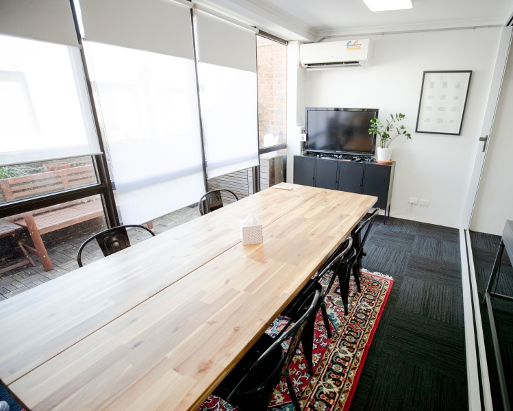 A dedicated desk in a creative video agency office photo 4
