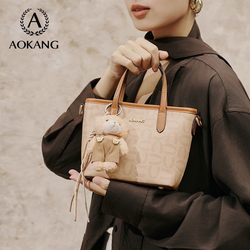 Aokang Women's Trendy Handheld Bucket Crossbody Bag with Teddy Bear Pendant