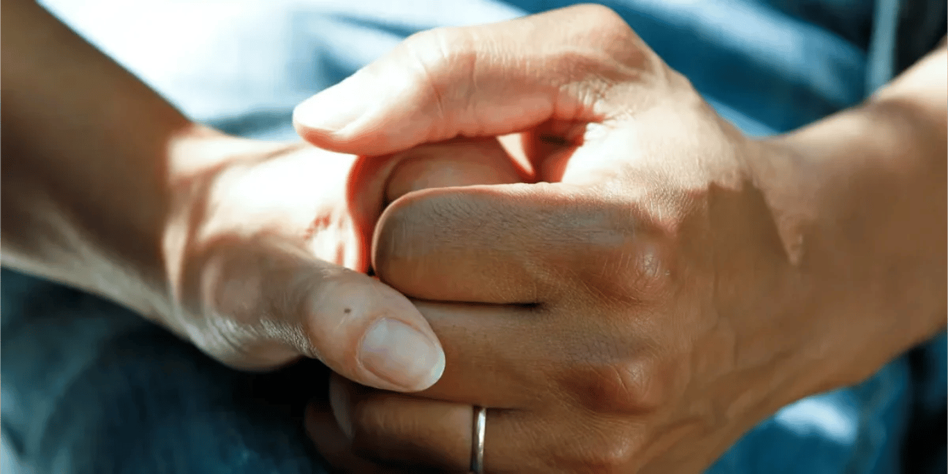 Hands held in support