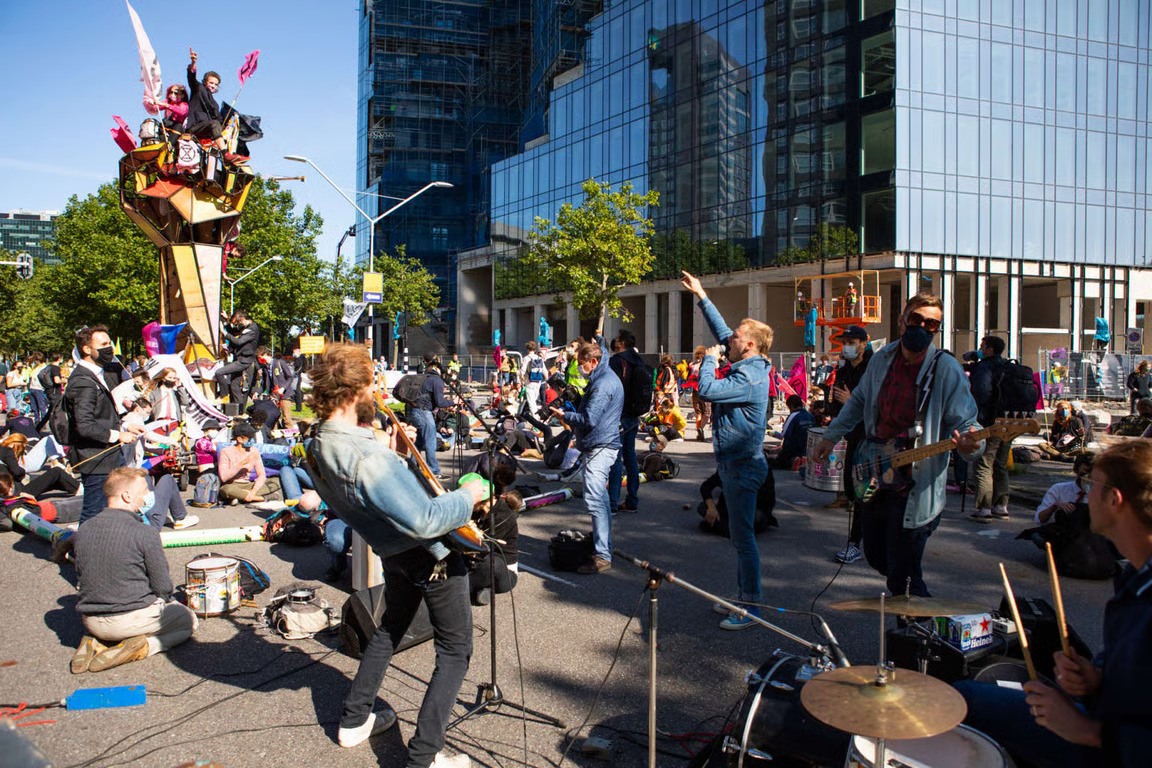 Musicians performing at a climate demonstration