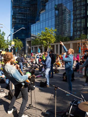 Musicians performing at a climate demonstration
