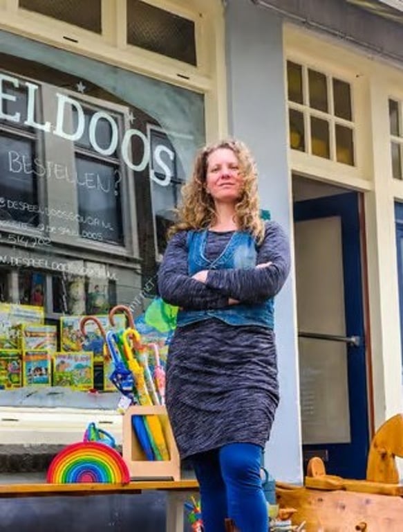 Shop owner outside her toy store