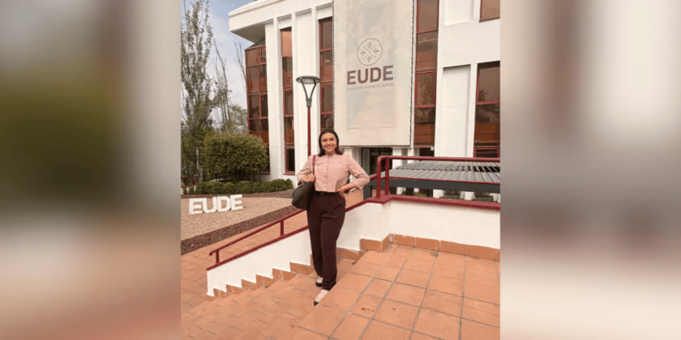 Student outside a business school campus