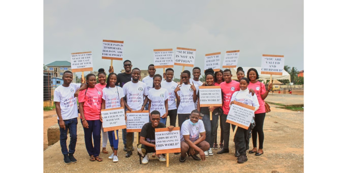 Youth awareness campaign group with signs