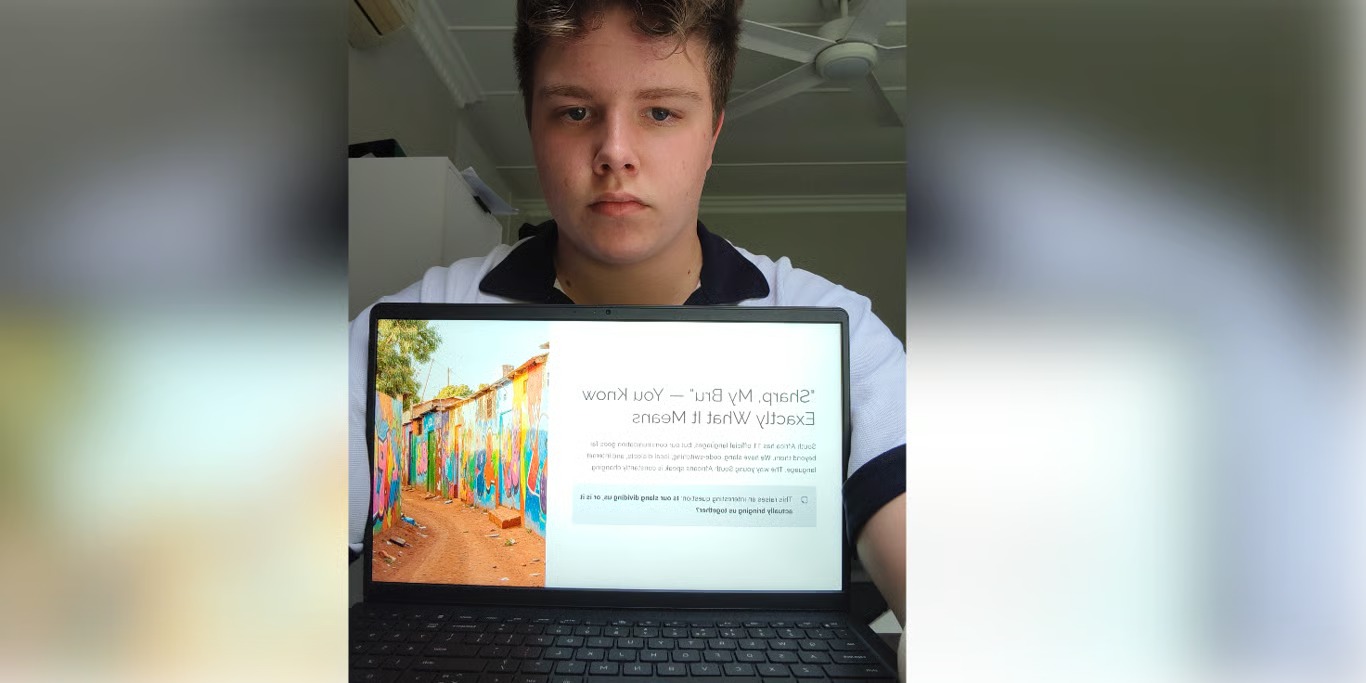 Student presenting his project on a laptop