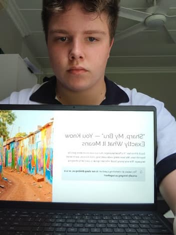 Student presenting his project on a laptop