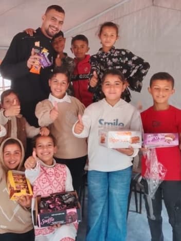 Children receiving treats at a relief tent