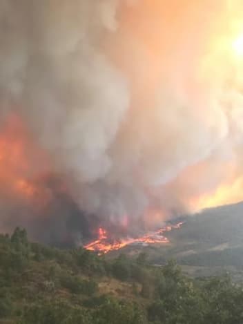 Wildfire spreading across the hills