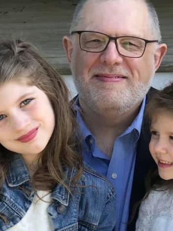 Grandfather with his two granddaughters