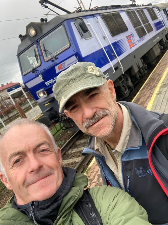 Two volunteers at a train station