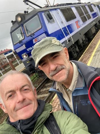 Two volunteers at a train station