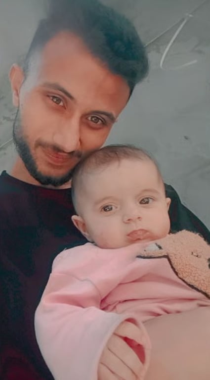 Father holding his baby daughter