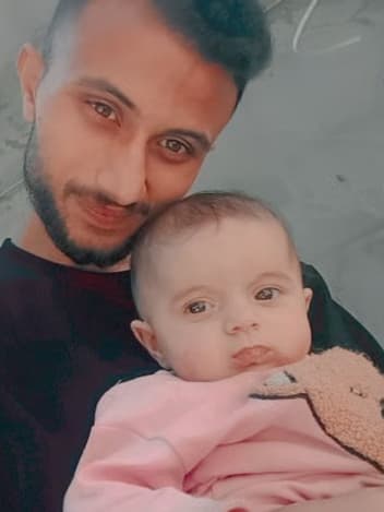 Father holding his baby daughter