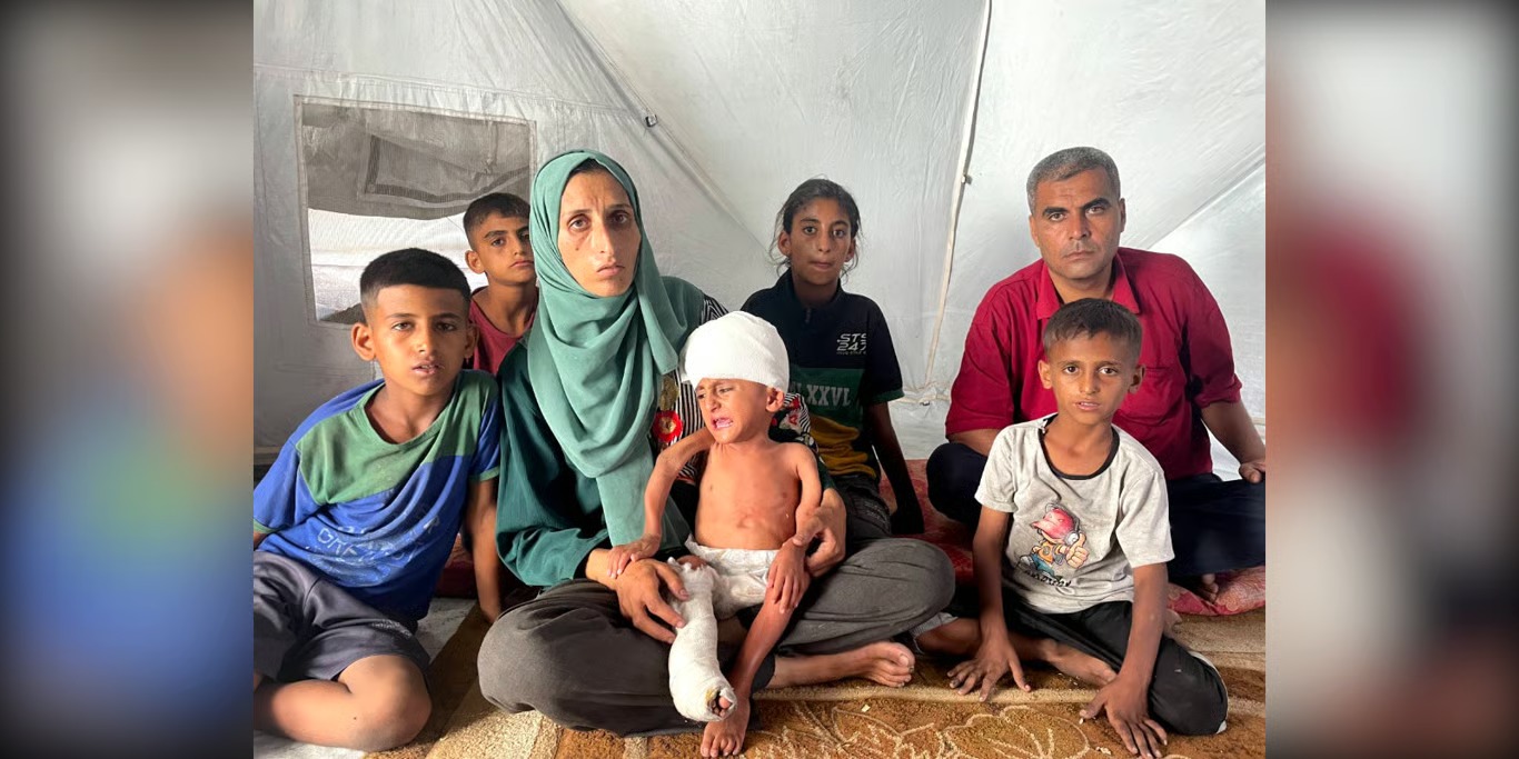 Family sitting together in a tent