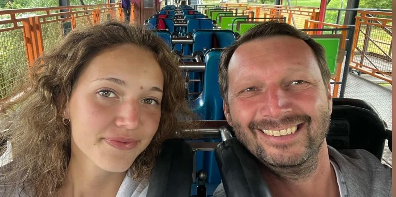 Father and daughter smiling together