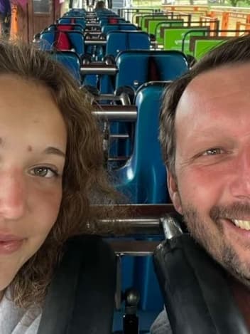 Father and daughter smiling together