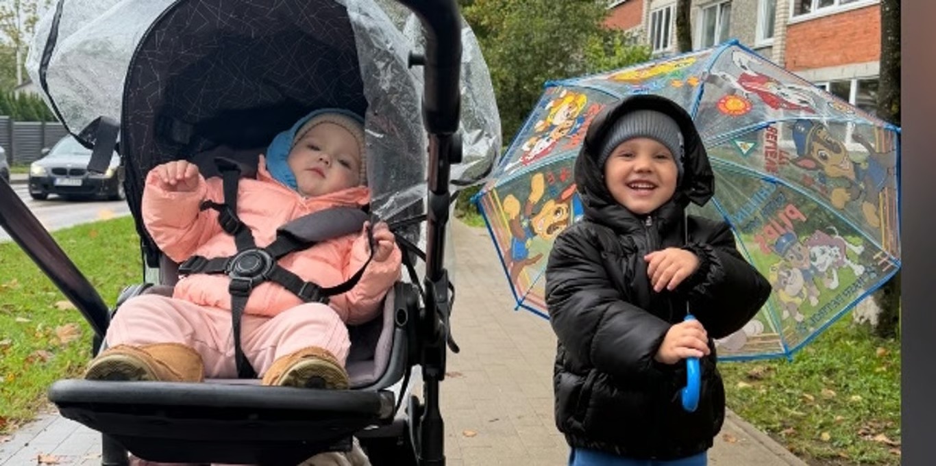 Siblings out on a rainy day