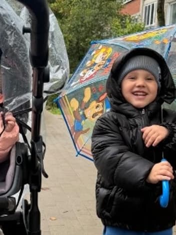 Siblings out on a rainy day